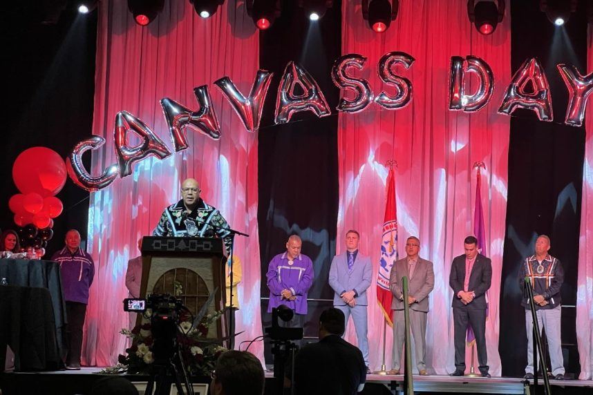 Man speaking at casino podium