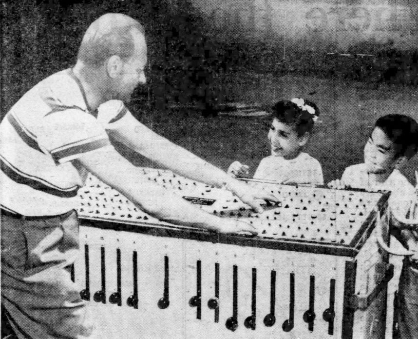 Man playing xylophone to kids