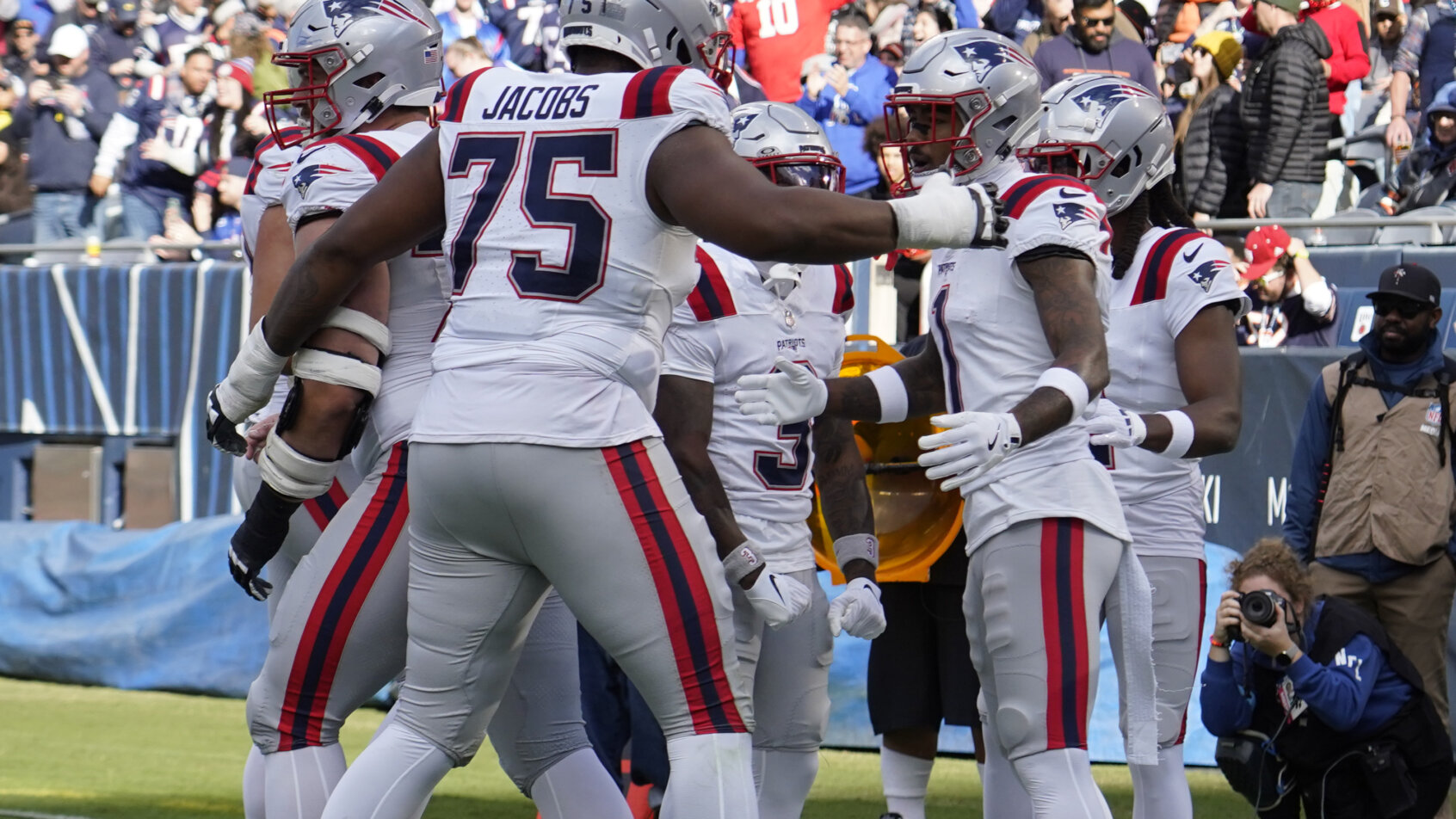 Patriots team celebrates on football field