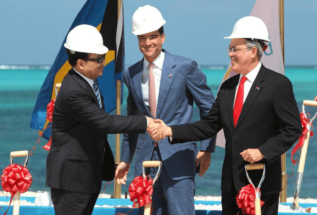 Three men handshake at Bahamas