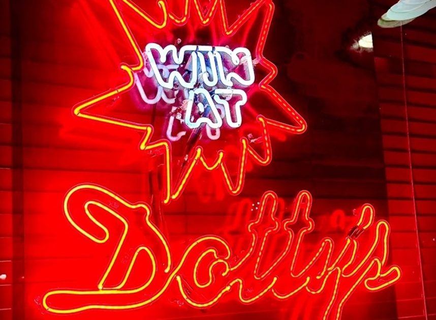 Dotty's neon casino sign illuminated