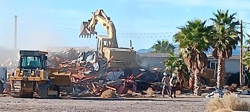 Excavator at demolition site