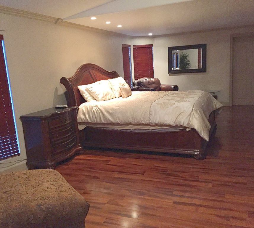 Spacious bedroom with large bed