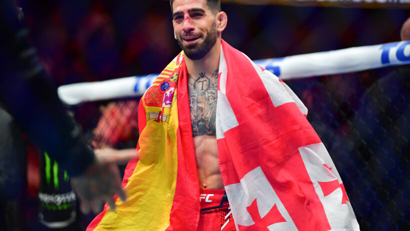 MMA fighter holding Brazilian flag