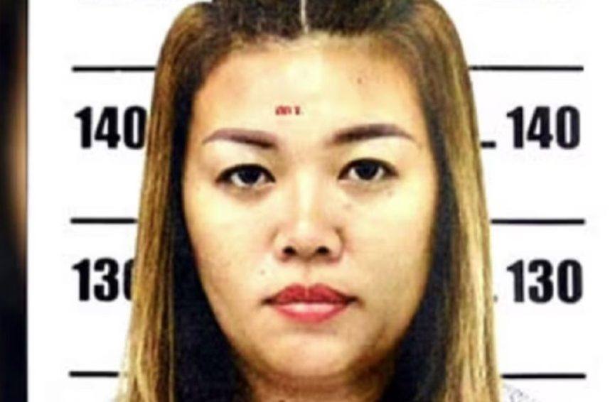 Female mugshot with height measurement background