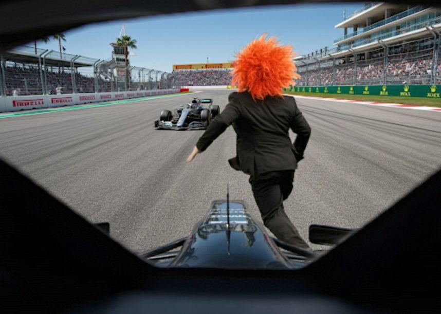 Carrot Top runs after race car