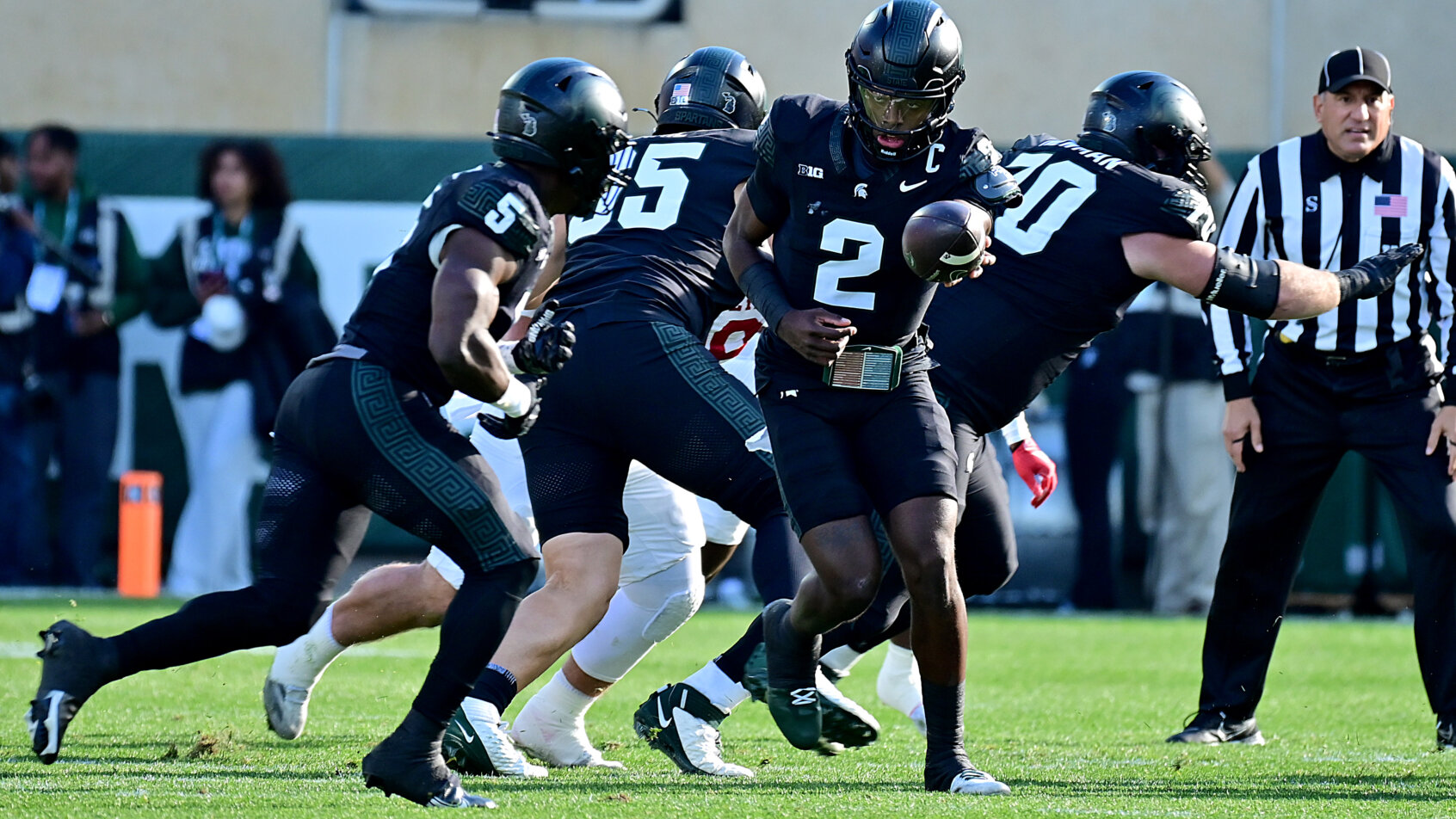 Player in black uniform running forward