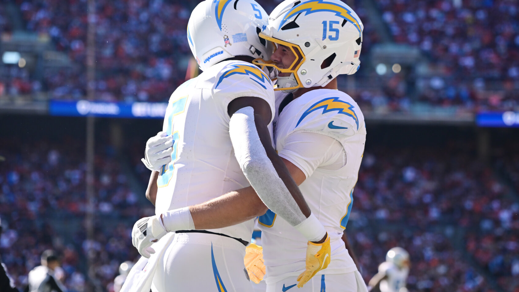 Chargers players celebrate on field