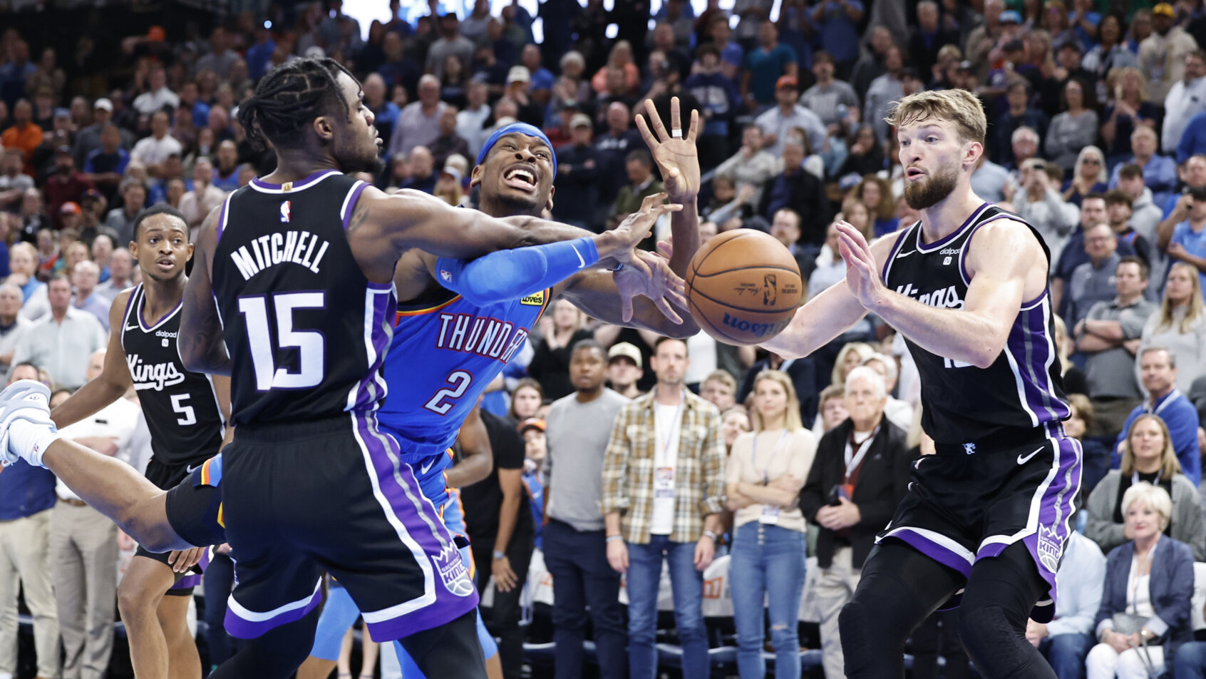 Thunder player battles for loose ball