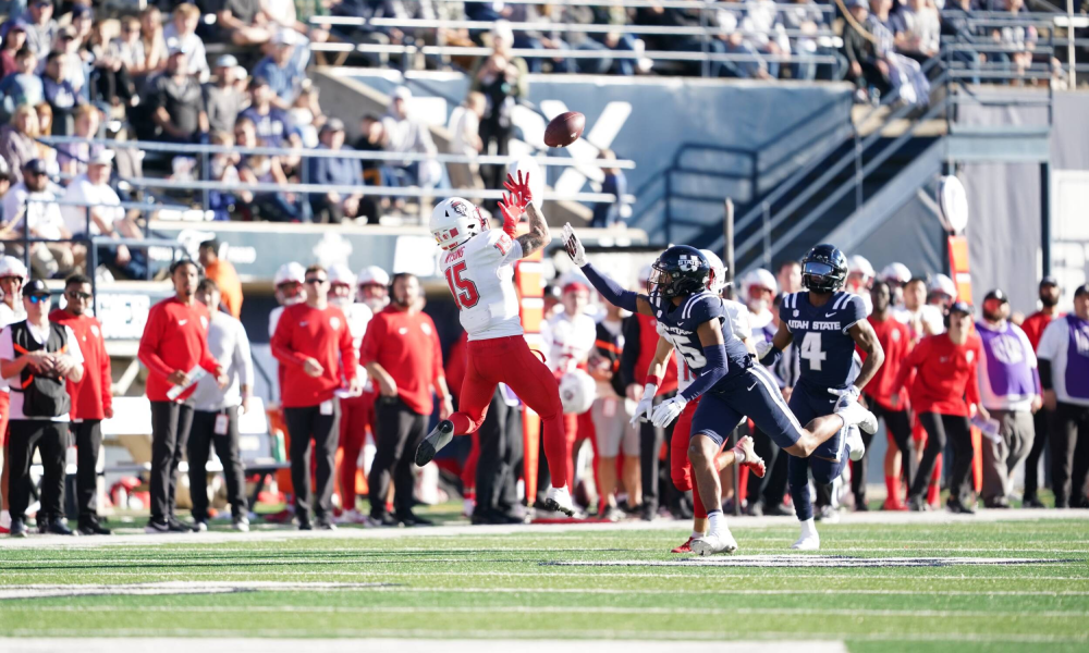 Football player making diving catch