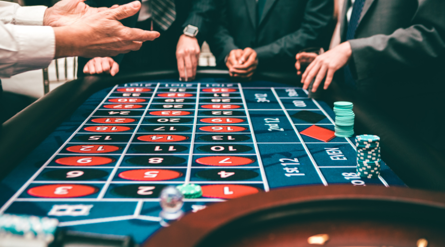 Players at casino roulette table