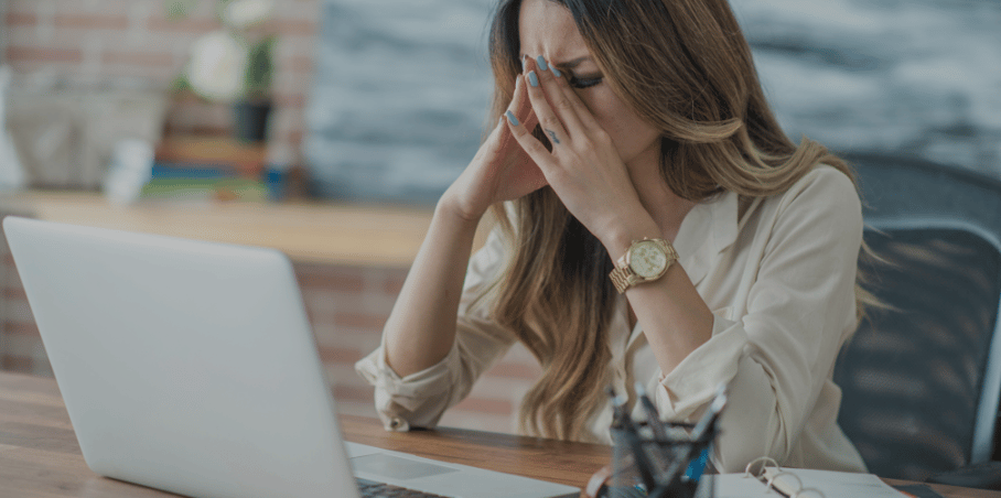 distressed woman covering her face