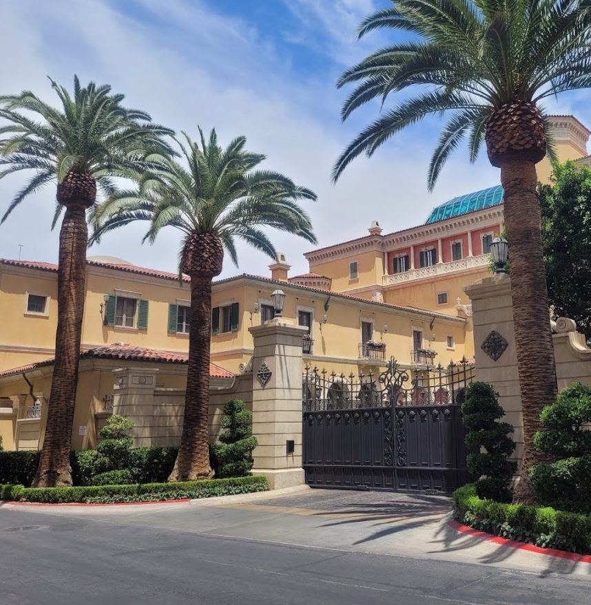 MGM Mansion with gate and palms