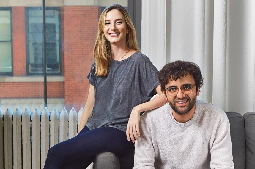 Professional couple posing in office