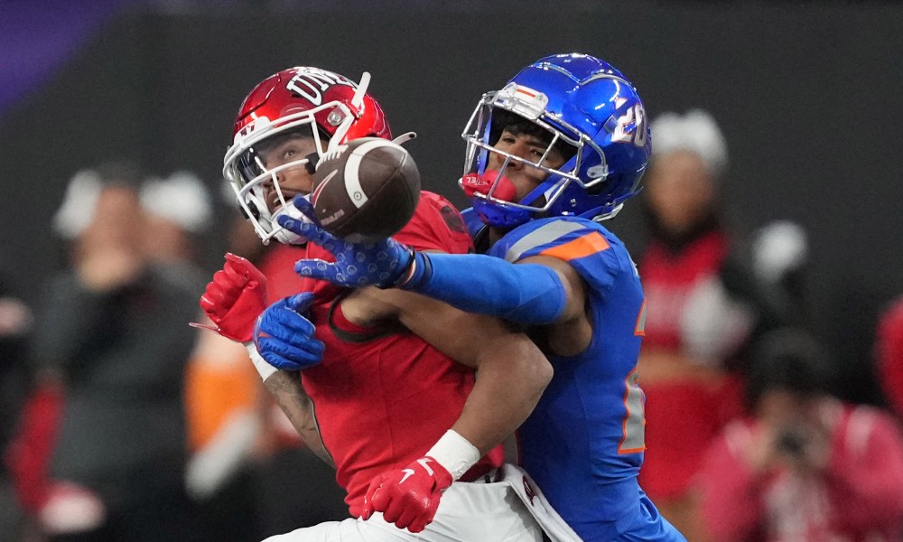 Football players collide during tackle