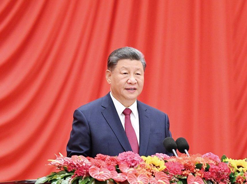 Xi Jinping at podium speaking