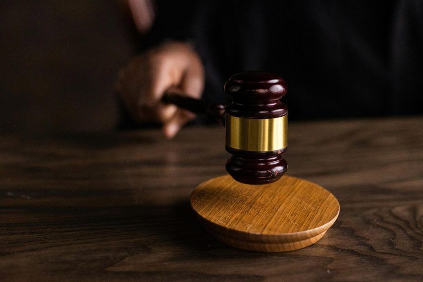 Wooden gavel on courtroom desk