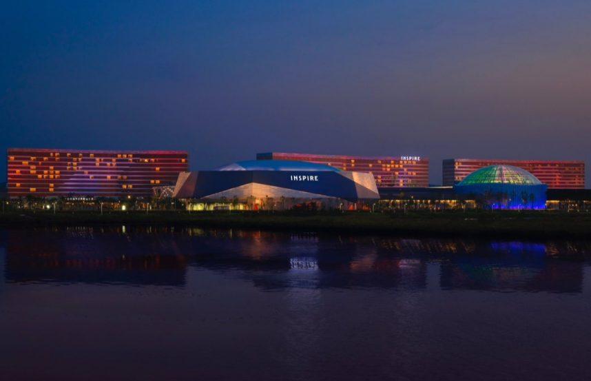 Illuminated casino reflecting on lake