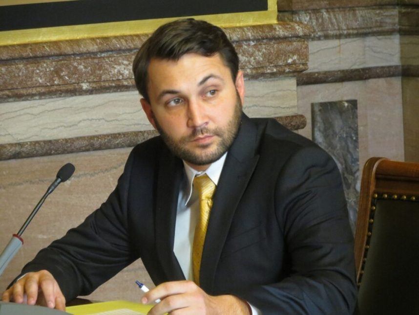 Man in business suit at table