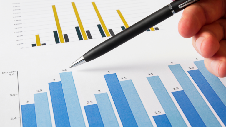 Hand analyzing trends dashboard data